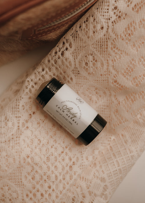 Skincare product on a textured beige surface